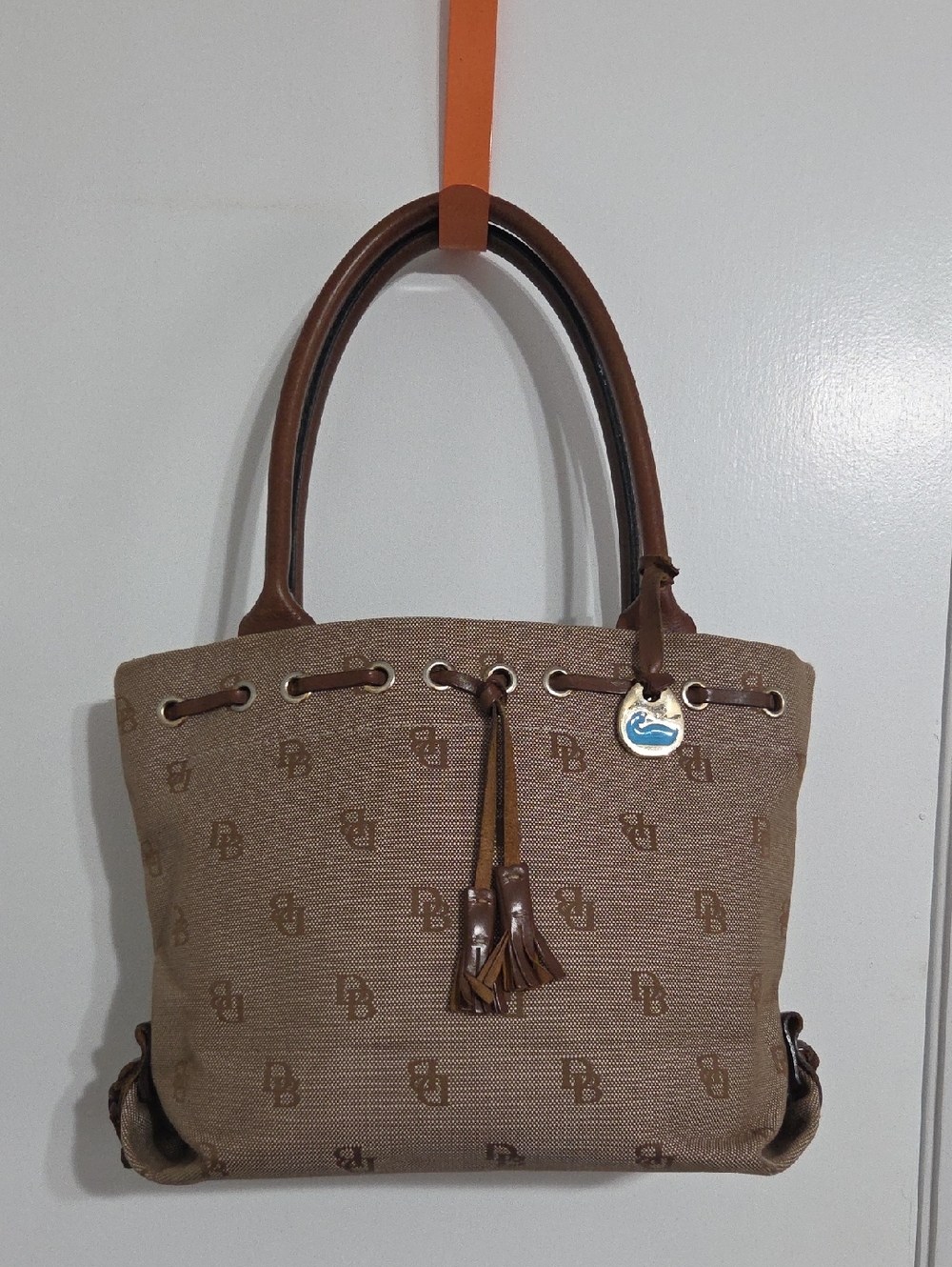 Dooney & Bourke Tan Brown Monogram Canvas Tote with Tassel